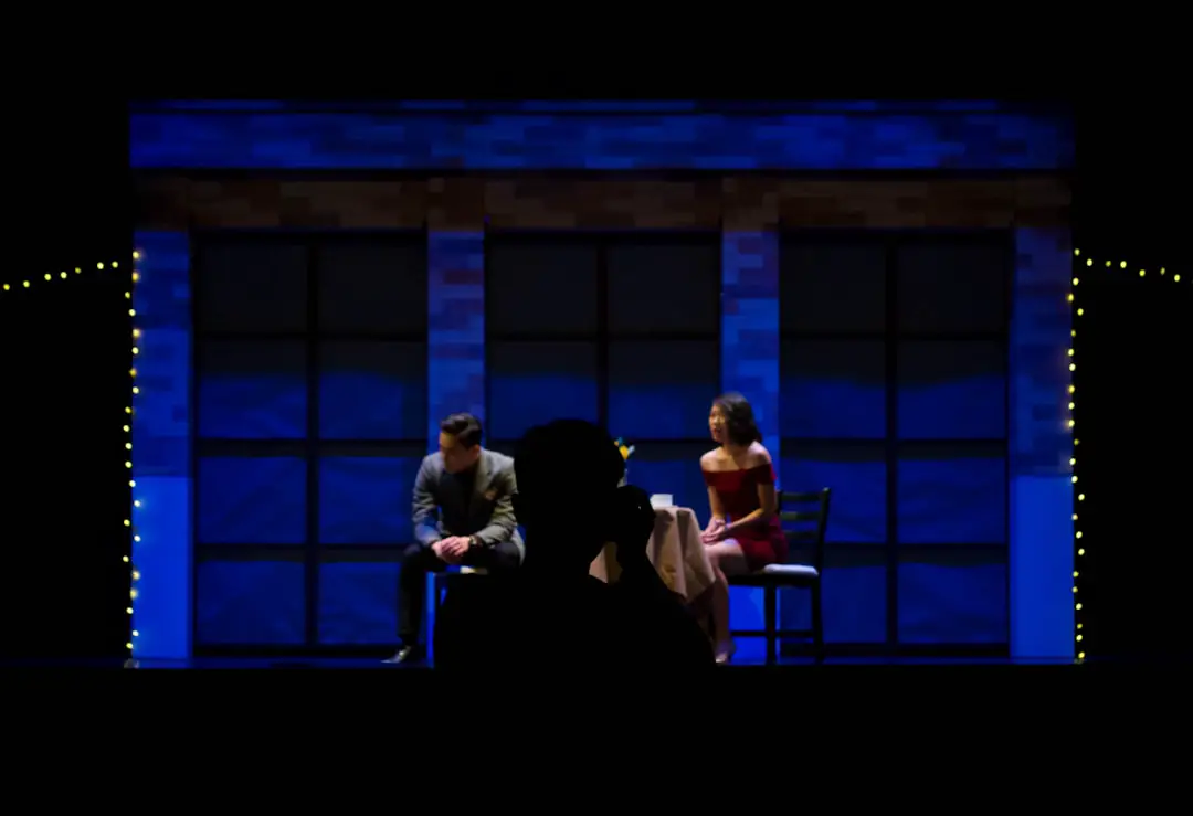 man and woman sitting on chair