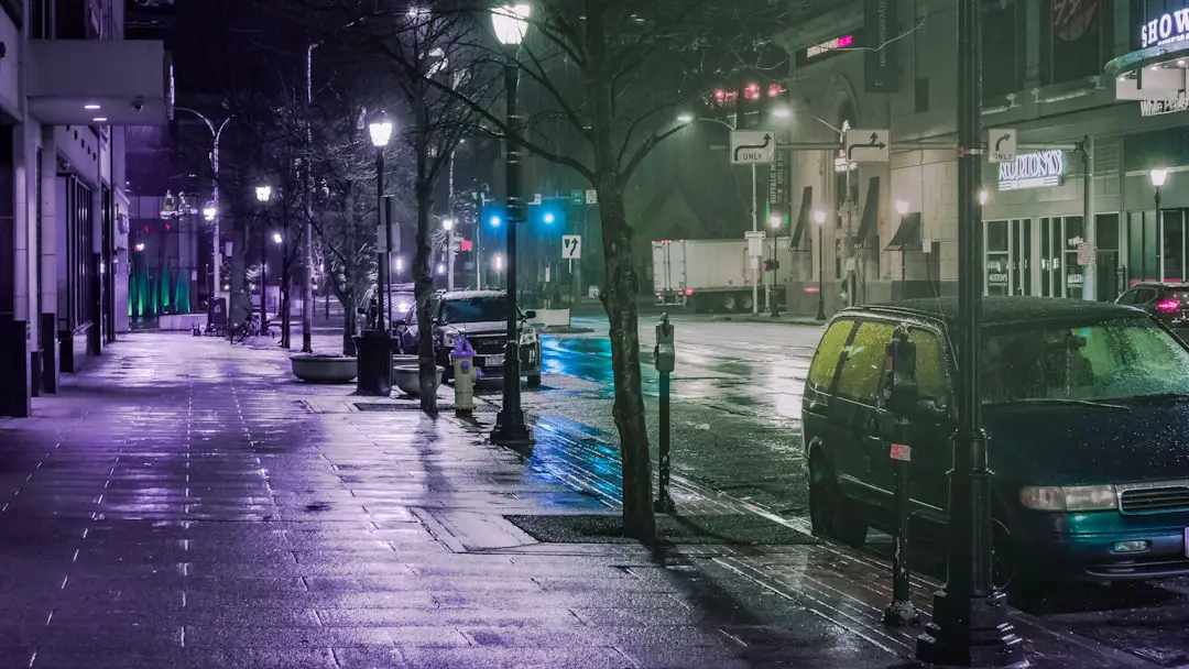 black car on road during night time
