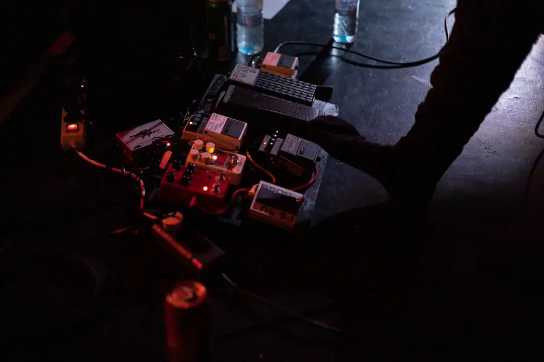 a dark room with some electronic equipment on the floor