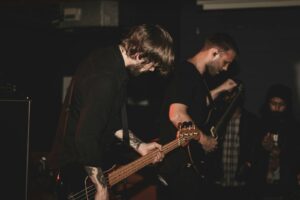 man playing bass guitar